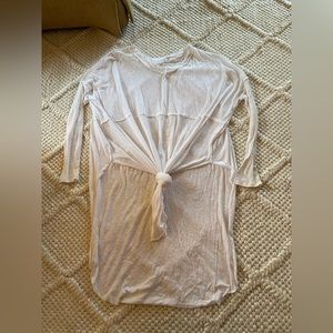 White long top with a knot in the front. Size small.